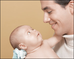 father looking at his baby as God looks at His children