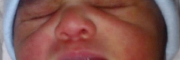 Close-up photo of baby Micha's face